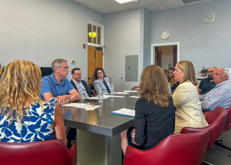Treasurer Frerichs meeting with a Charitable Trust recipient