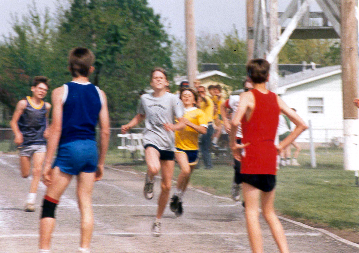 A young Treasurer Frerichs, around age 12, runs in a race outside with other boys